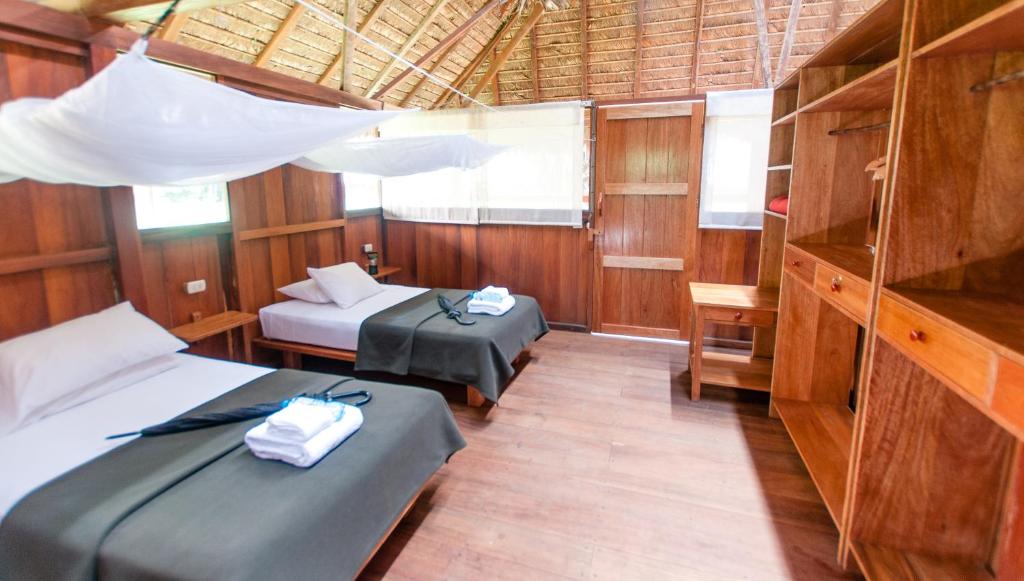 Postel nebo postele na pokoji v ubytování Amazon Field Station byInkaterra