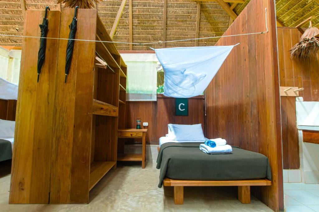 Postel nebo postele na pokoji v ubytování Amazon Field Station byInkaterra