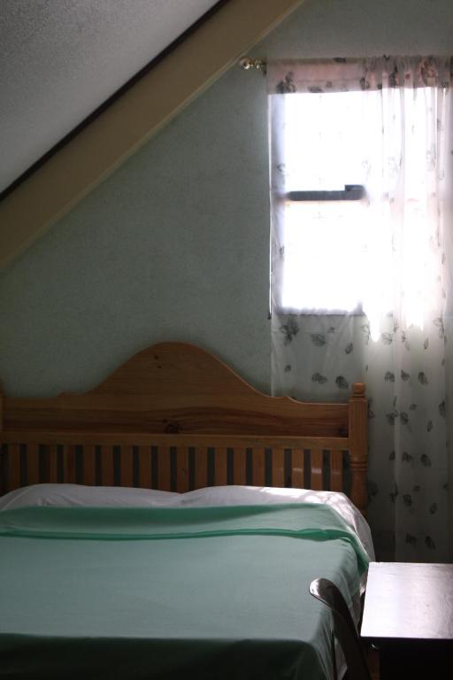 Postel nebo postele na pokoji v ubytování Mayoyao View Inn