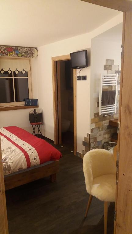 Telewizja i/lub zestaw kina domowego w obiekcie Majon de la nona