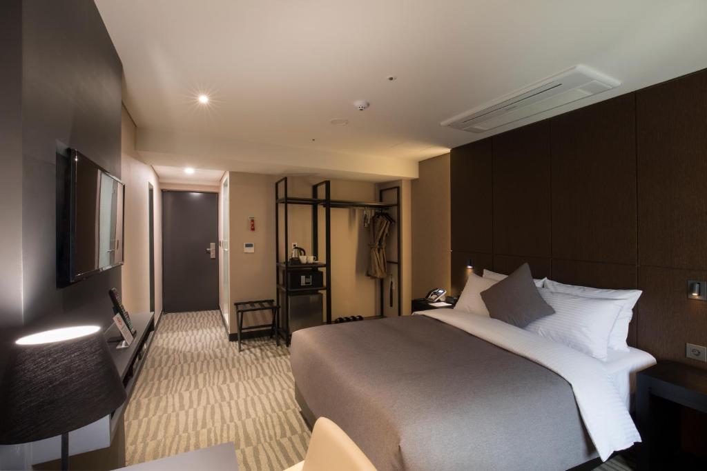 Postel nebo postele na pokoji v ubytování Hotel Foret Premier Nampo