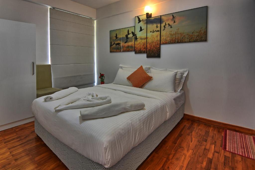 מיטה או מיטות בחדר ב-Vista Apartment Mariners Cabin
