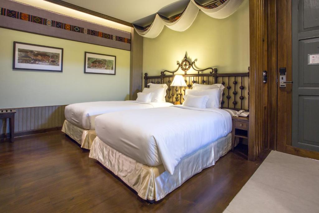 Postel nebo postele na pokoji v ubytování Chankam Boutique Hotel