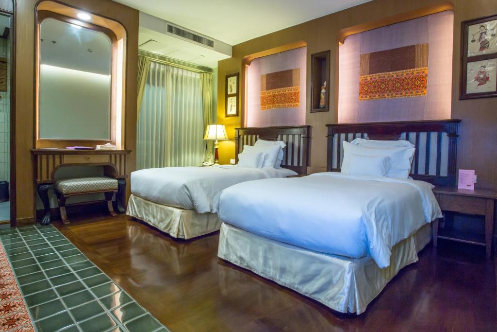 Postel nebo postele na pokoji v ubytování Chankam Boutique Hotel
