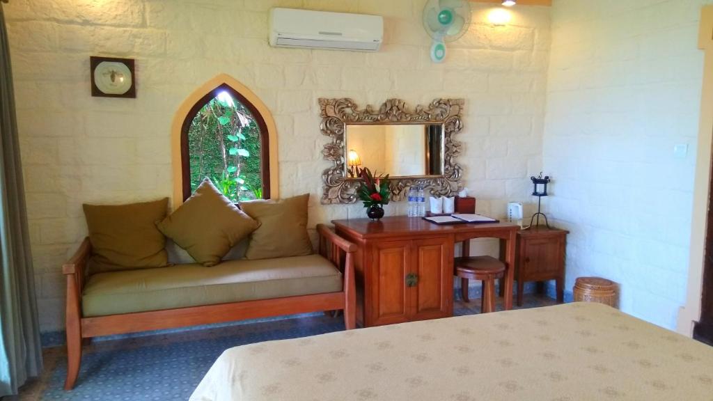 Postel nebo postele na pokoji v ubytování Gajah Mina Beach Resort