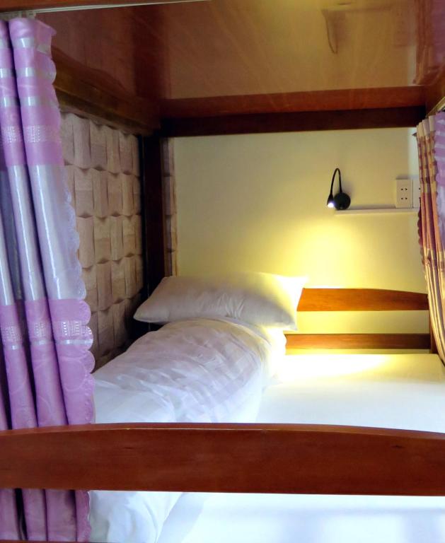 Postel nebo postele na pokoji v ubytování Ha Giang 1 Hostel and Loop Tour