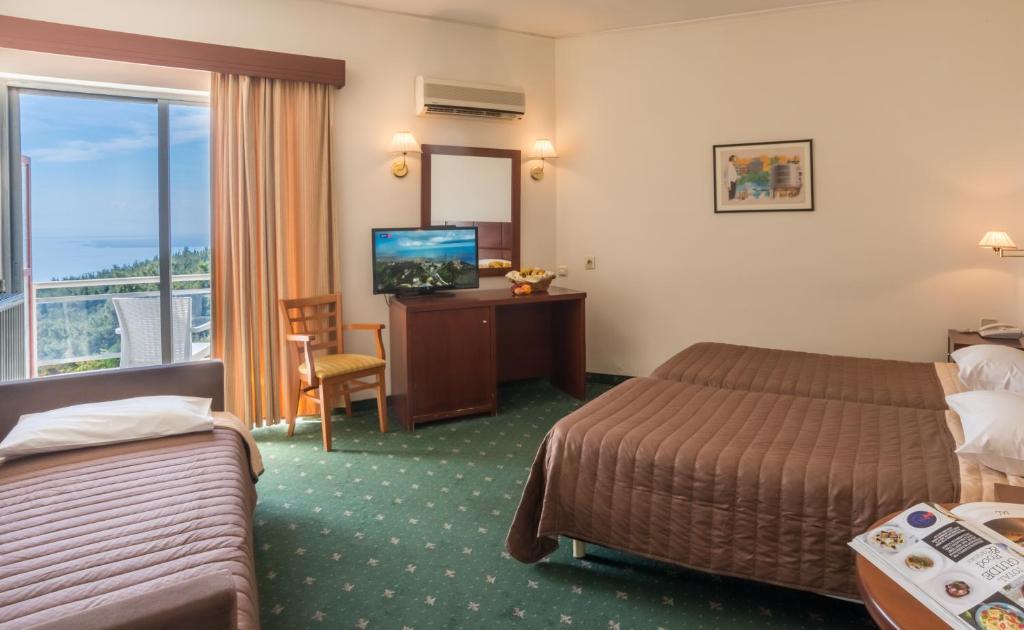 A bed or beds in a room at Philippion