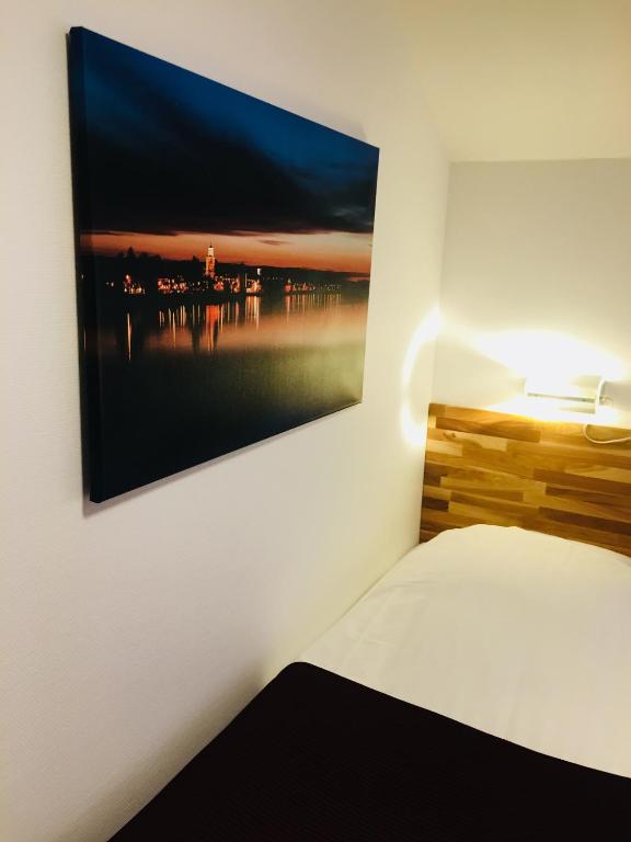 Postel nebo postele na pokoji v ubytování Munken Hotell & Konferens