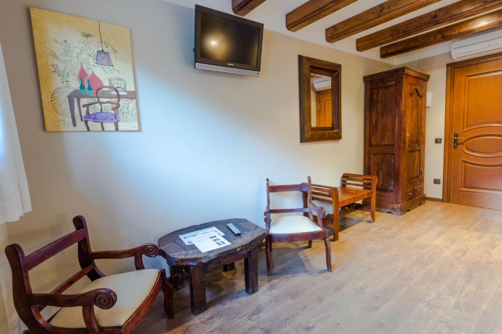 TV a/nebo společenská místnost v ubytování Hotel Flor De Neu