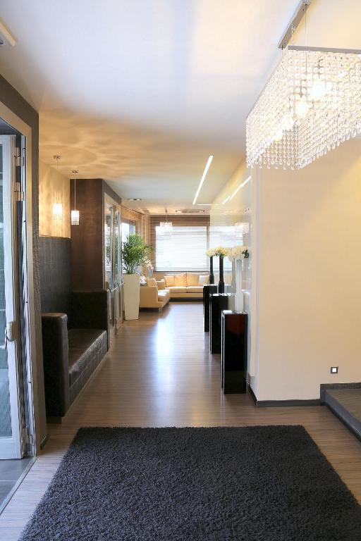 a hallway with a couch and a living room at Hotel Carla in Levanto