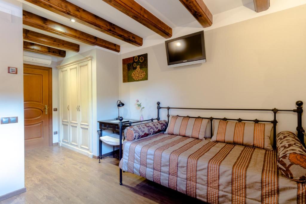 Postel nebo postele na pokoji v ubytování Hotel Flor De Neu