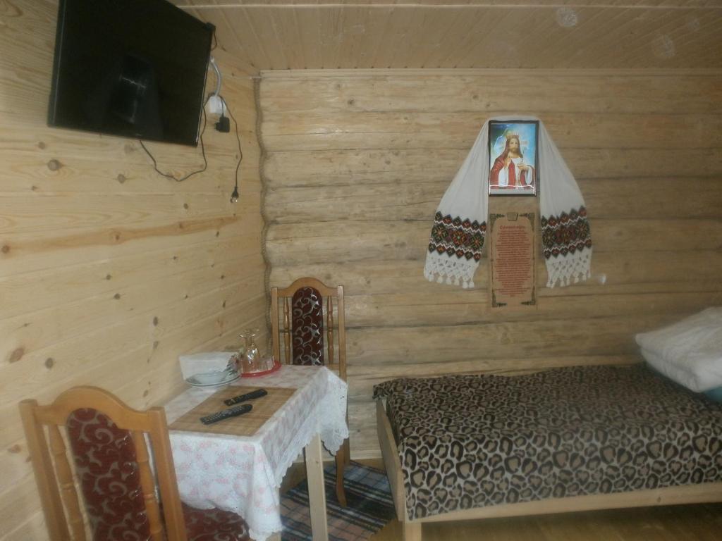 TV a/nebo společenská místnost v ubytování Cottage Лісовий