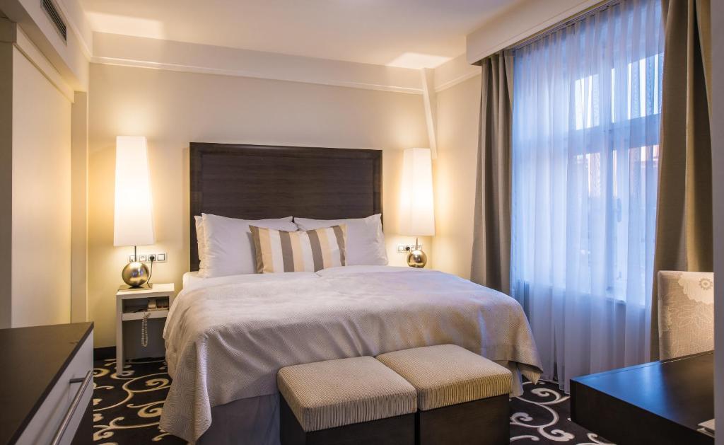 Postel nebo postele na pokoji v ubytování Grand Hotel Bohemia