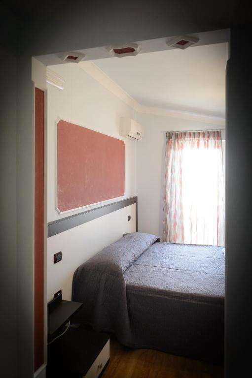 Postel nebo postele na pokoji v ubytování B&B Le Gemme