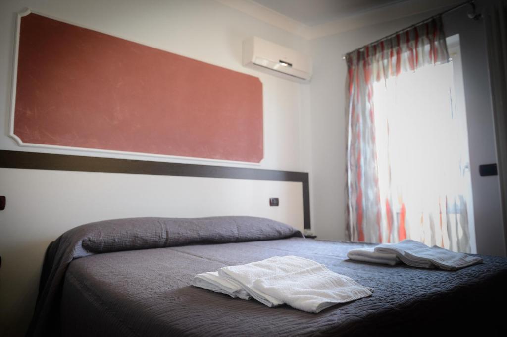 Postel nebo postele na pokoji v ubytování B&B Le Gemme
