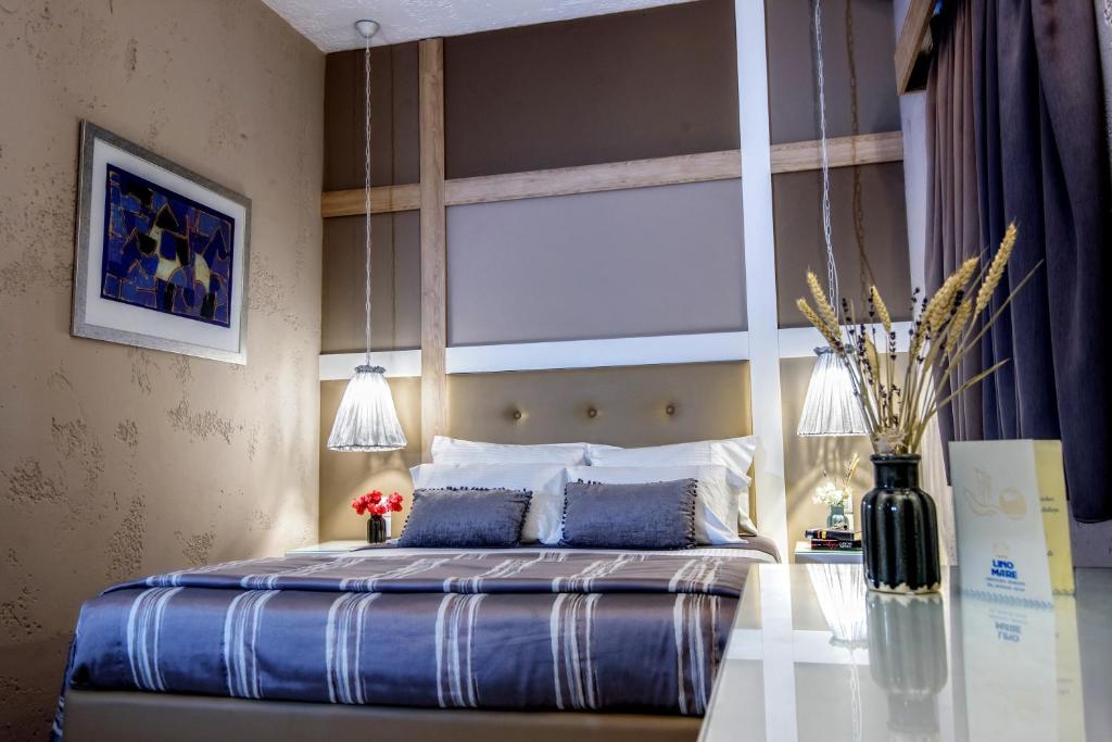 Postel nebo postele na pokoji v ubytování Lino Mare Boutique Hotel