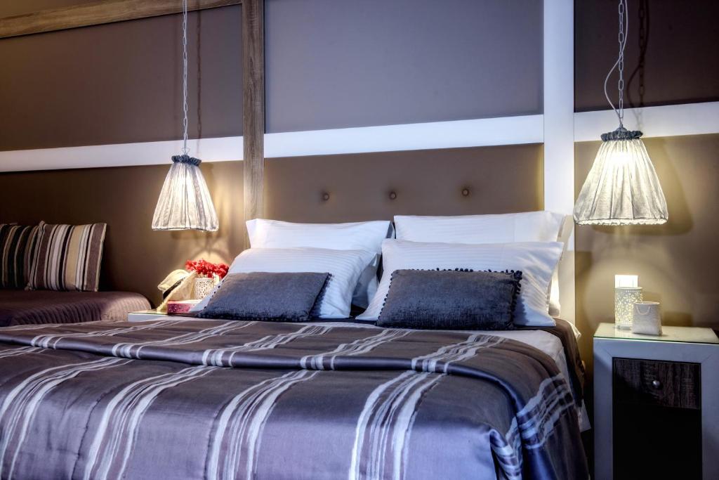 Postel nebo postele na pokoji v ubytování Lino Mare Boutique Hotel
