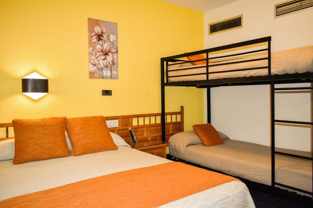Postel nebo postele na pokoji v ubytování Hotel La Colina