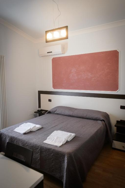 Postel nebo postele na pokoji v ubytování B&B Le Gemme