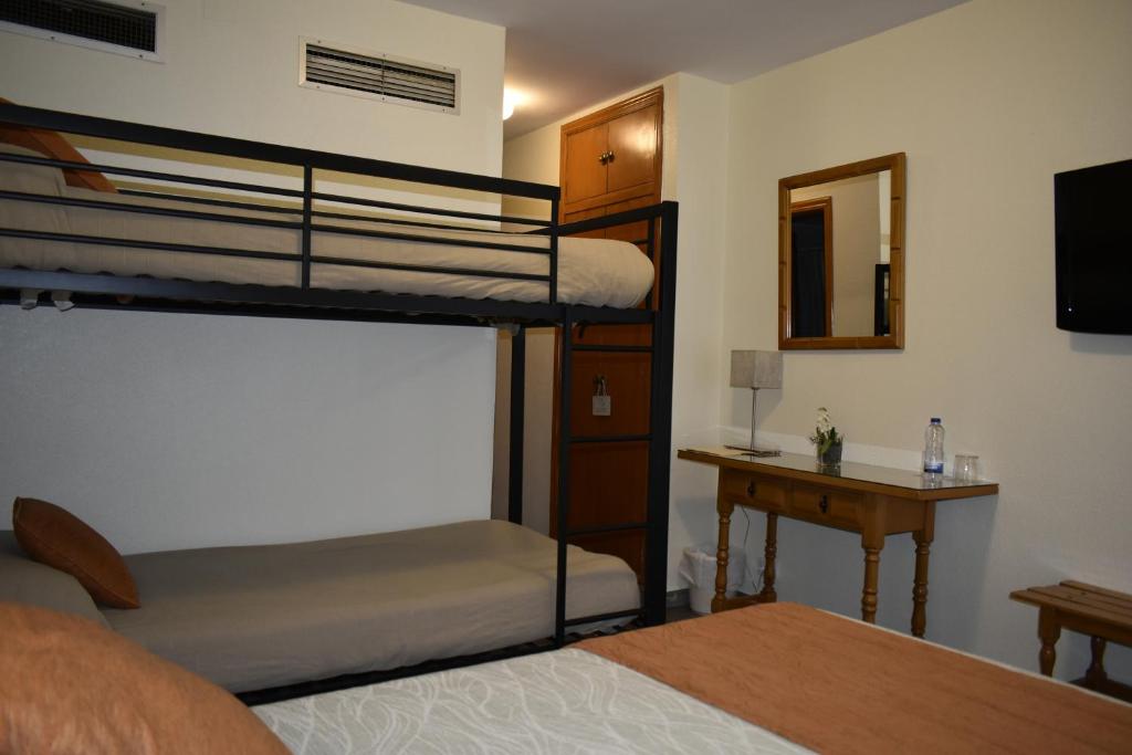 Postel nebo postele na pokoji v ubytování Hotel La Colina