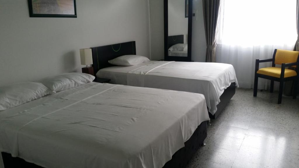 Postel nebo postele na pokoji v ubytování Hotel Albatros