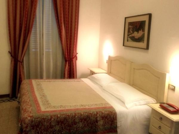 Posteľ alebo postele v izbe v ubytovaní Hotel Umbria