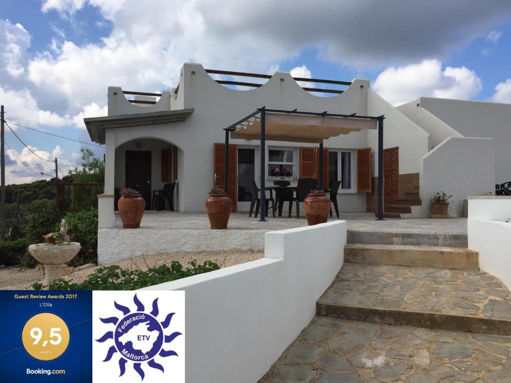 a villa with a view of a house at L'Olla in Cala Ratjada