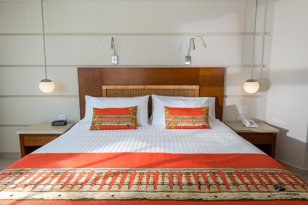Postel nebo postele na pokoji v ubytování Hotel Dann Cartagena