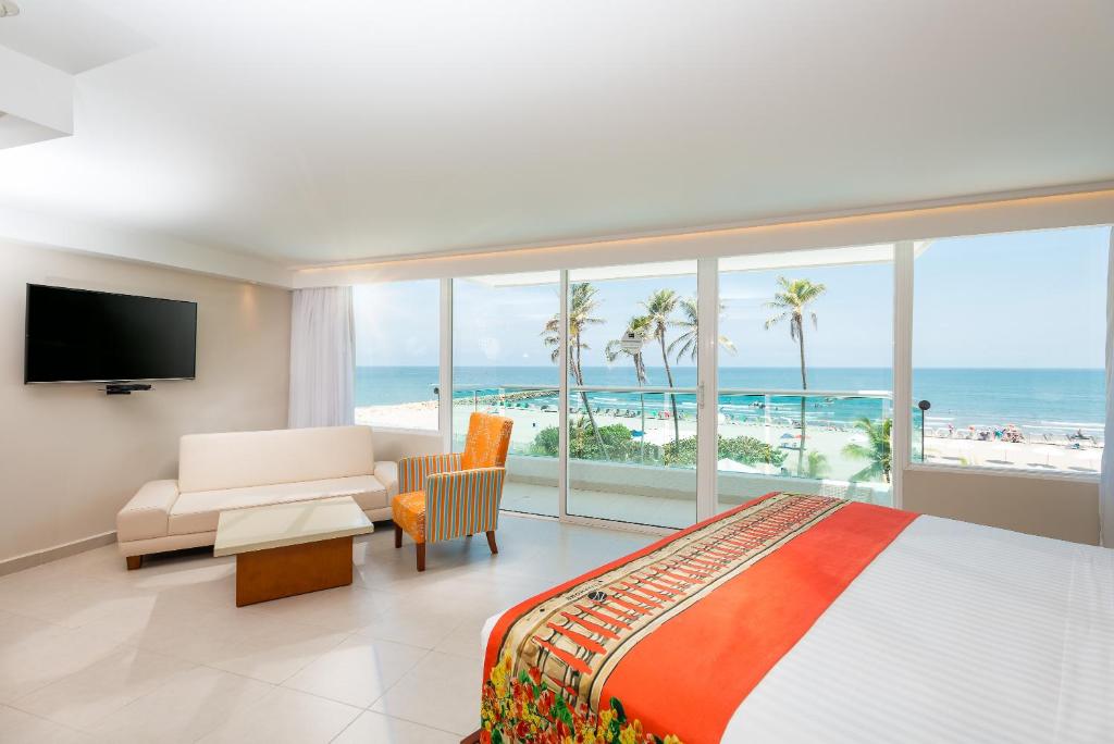Postel nebo postele na pokoji v ubytování Hotel Dann Cartagena