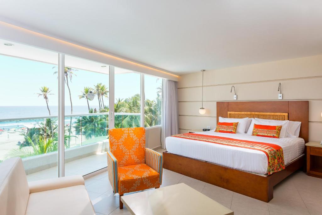 Postel nebo postele na pokoji v ubytování Hotel Dann Cartagena