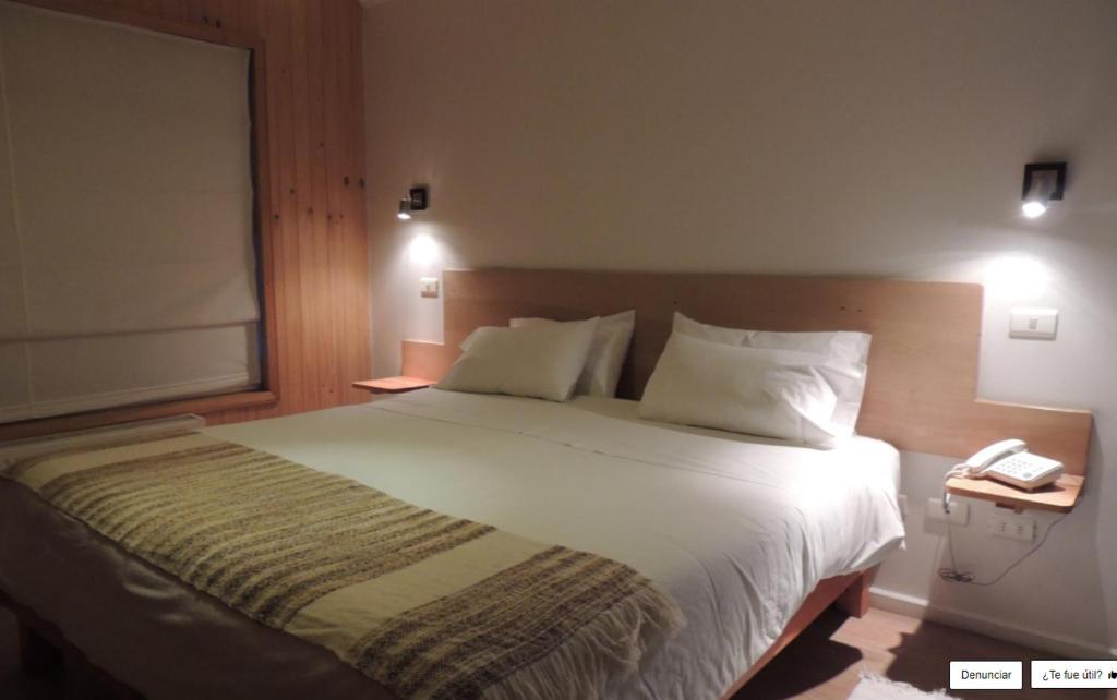 Postel nebo postele na pokoji v ubytování Hotel Ilaia