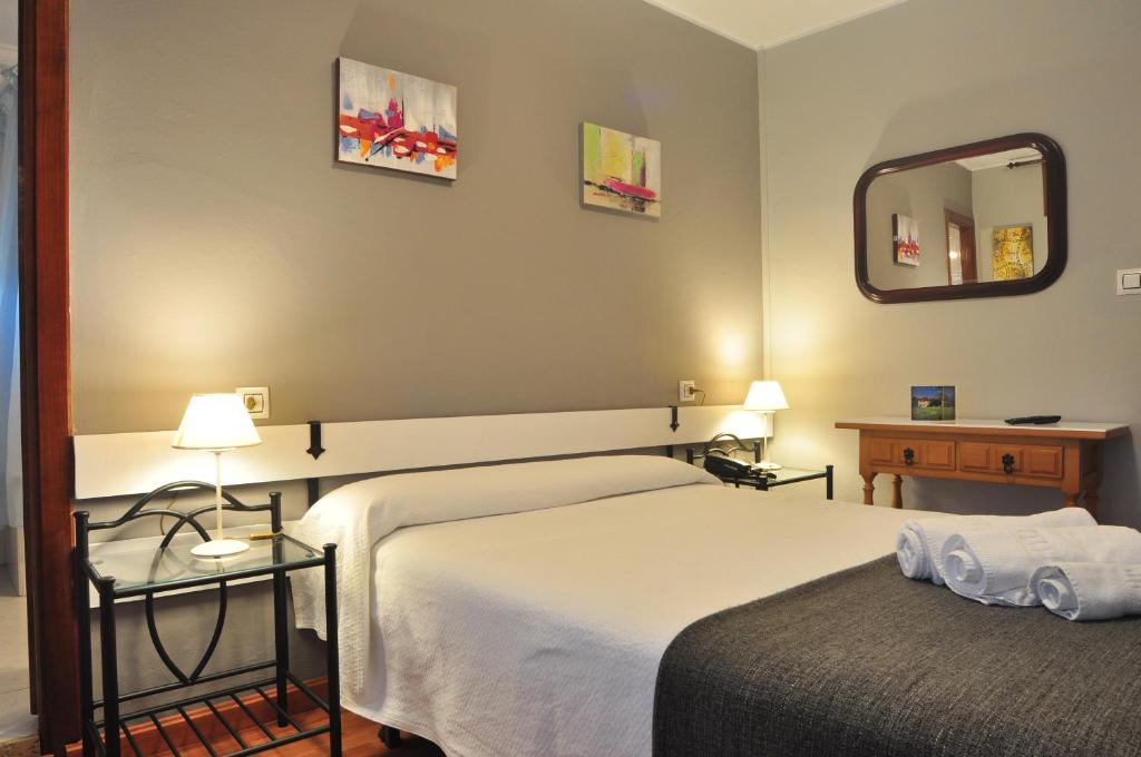 Postel nebo postele na pokoji v ubytování Hostal Europa