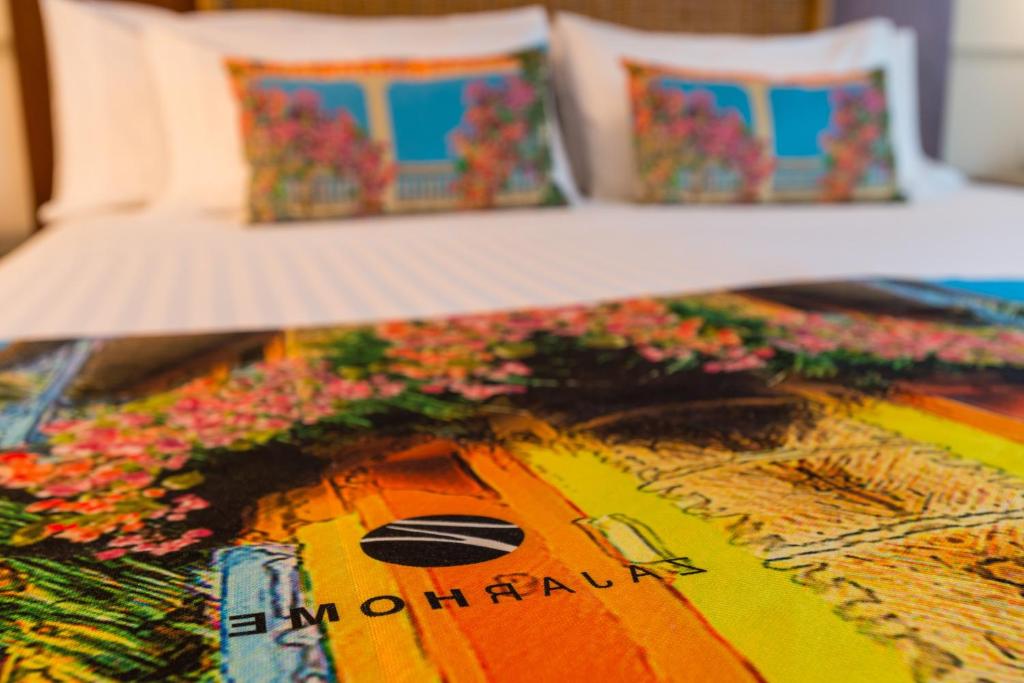 Postel nebo postele na pokoji v ubytování Hotel Dann Cartagena