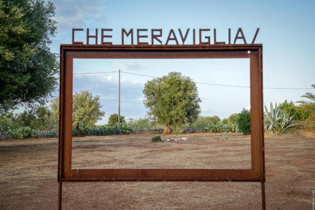a mirror with the words the merkwelha sign on it at Case d'Artista in Savelletri di Fasano