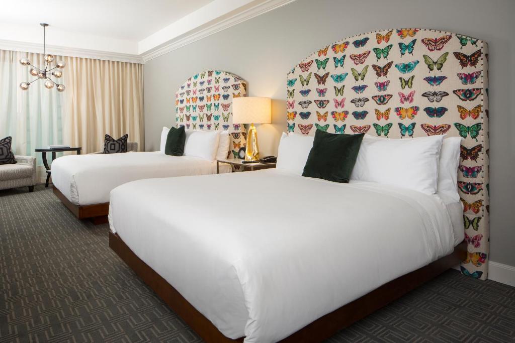 A bed or beds in a room at Hotel ZaZa Houston Memorial City