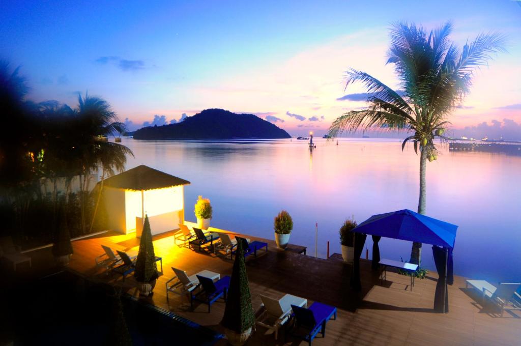 a resort with a view of a body of water at Phuket Boat Quay in Panwa Beach