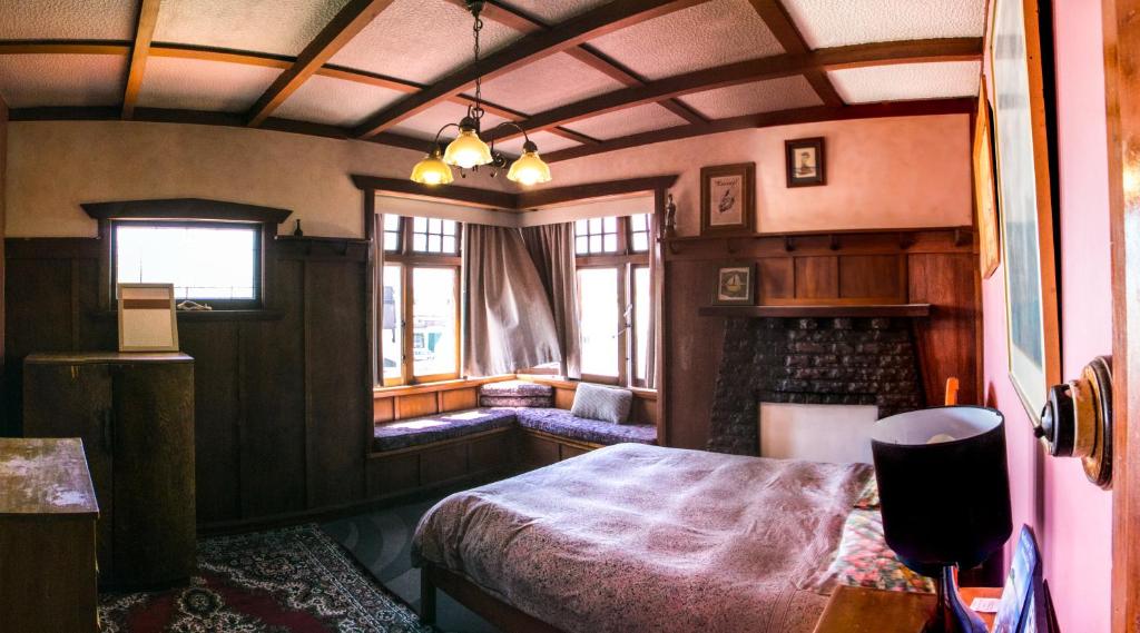 Postel nebo postele na pokoji v ubytování The Palace Backpackers