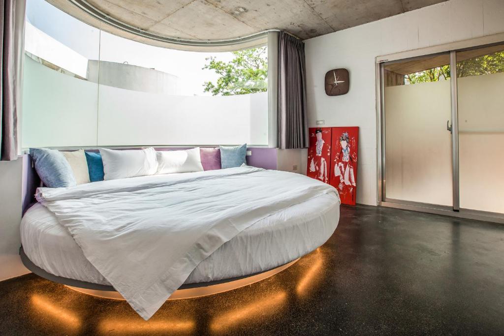 Postel nebo postele na pokoji v ubytování Yu Peng Villa