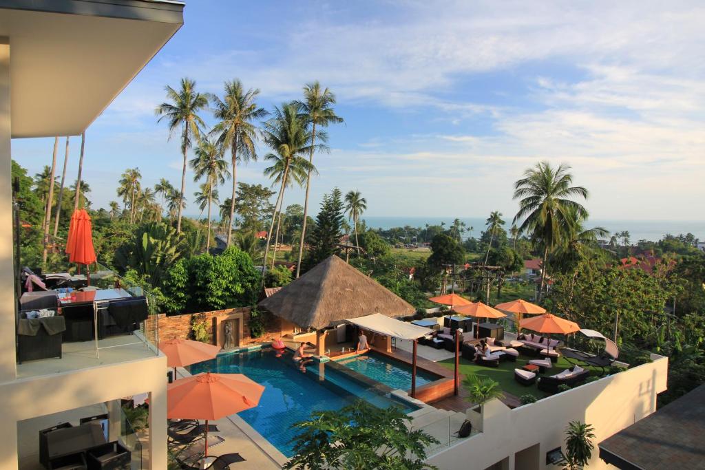 an aerial view of a resort with a pool and palm trees at Baan Seaview Holiday Villas in Lamai