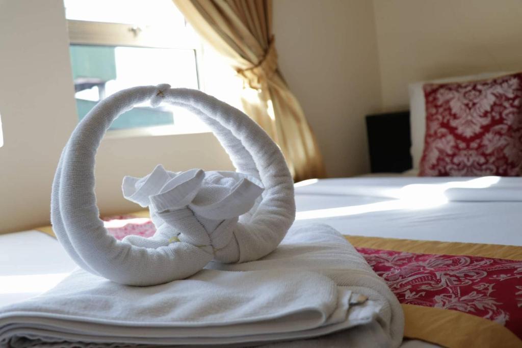 Postel nebo postele na pokoji v ubytování Salita Hotel