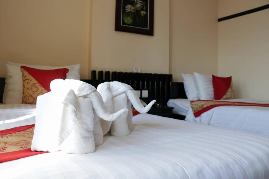 Postel nebo postele na pokoji v ubytování Salita Hotel