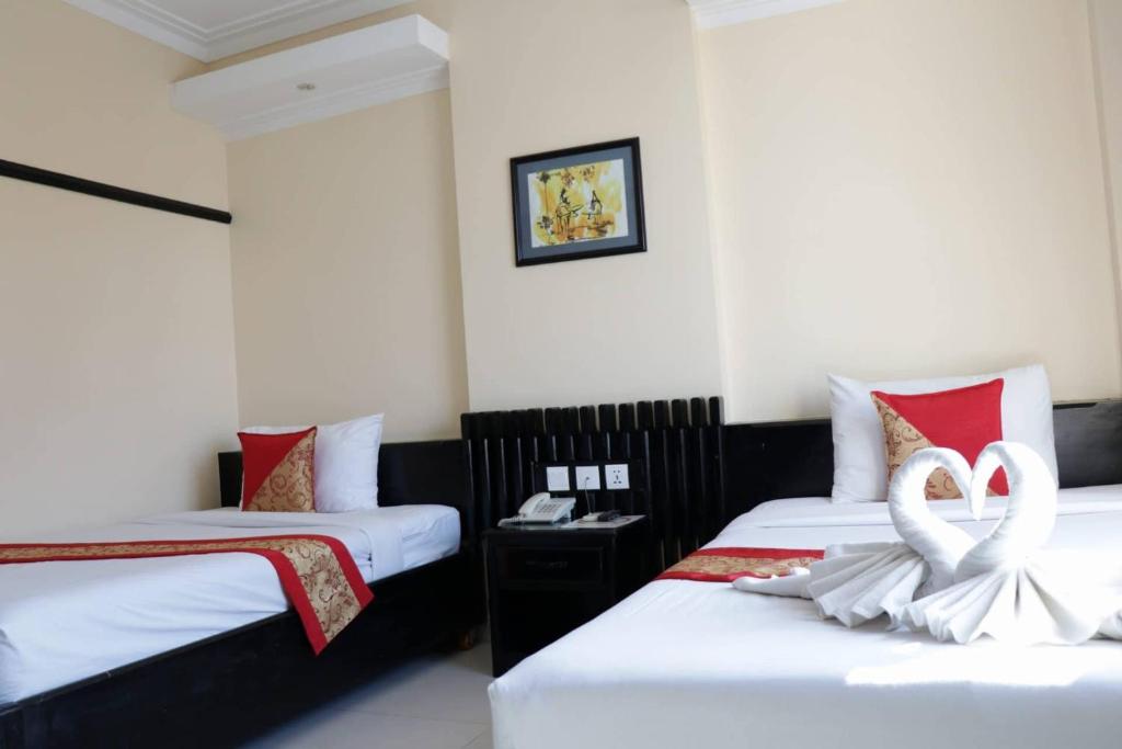 Postel nebo postele na pokoji v ubytování Salita Hotel