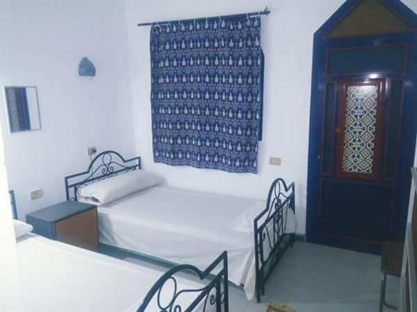 Postel nebo postele na pokoji v ubytování Monica Hotel