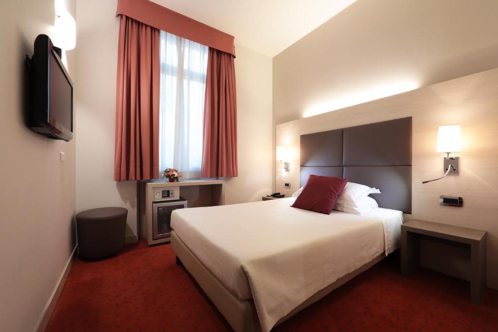 Postel nebo postele na pokoji v ubytování Hotel Campion