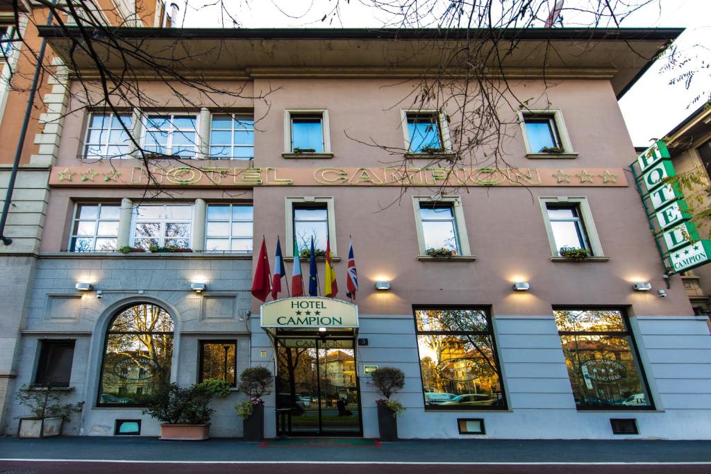 a building with a sign on the front of it at Hotel Campion in Milan