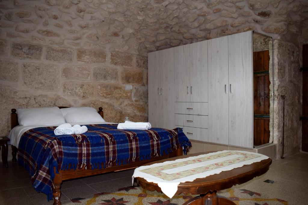 Postel nebo postele na pokoji v ubytování Hosh Al Subbar