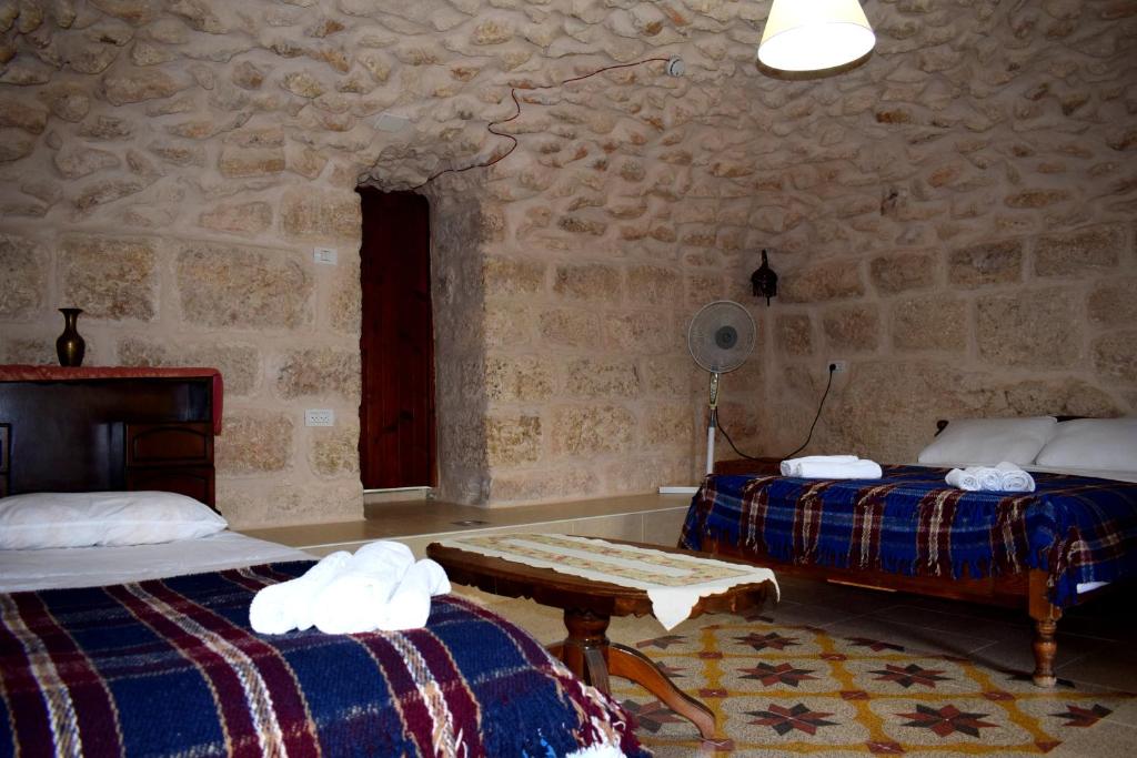 Postel nebo postele na pokoji v ubytování Hosh Al Subbar