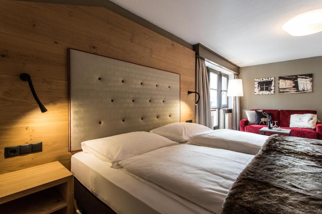 Postel nebo postele na pokoji v ubytování Hotel Valentin