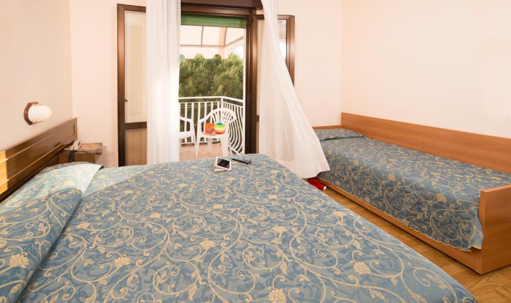 Postel nebo postele na pokoji v ubytování Hotel Trevi