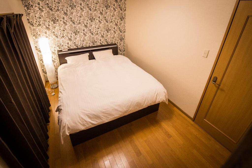Postel nebo postele na pokoji v ubytování Buddha House